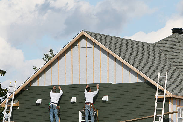 Professional Storm Damage Siding Repair technician working in Hallwood, VA